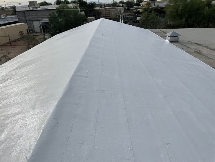 Monsoon roof protection Roof coating protecting a flat roof from monsoon rain in Tucson