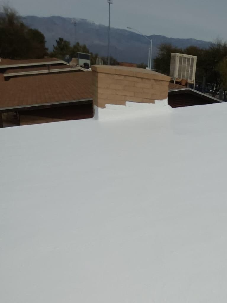 Emergency night response scene Universal Roofing technician handling an emergency roof repair in Tucson