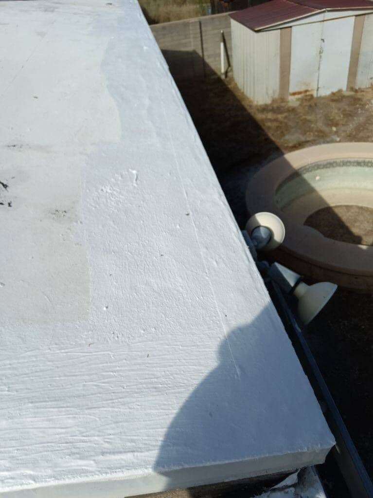 Review conversation scene Homeowner reviewing Universal Roofing service notes with technician on a tablet